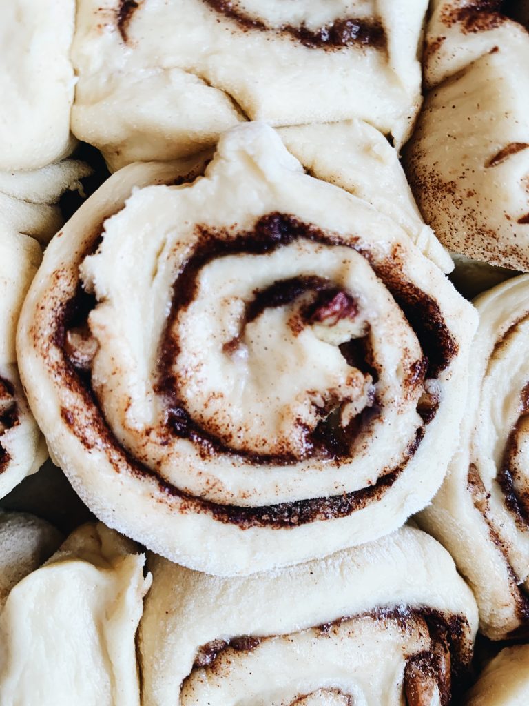 unbaked cinnamon rolls in a pan