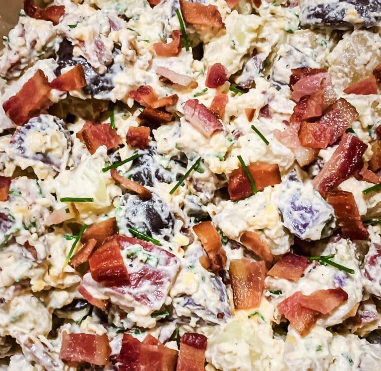 potato salad with red, white and blue potatoes, herbs, cheese and mayo