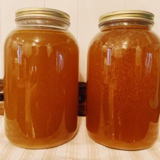 Two gallon jars of broth