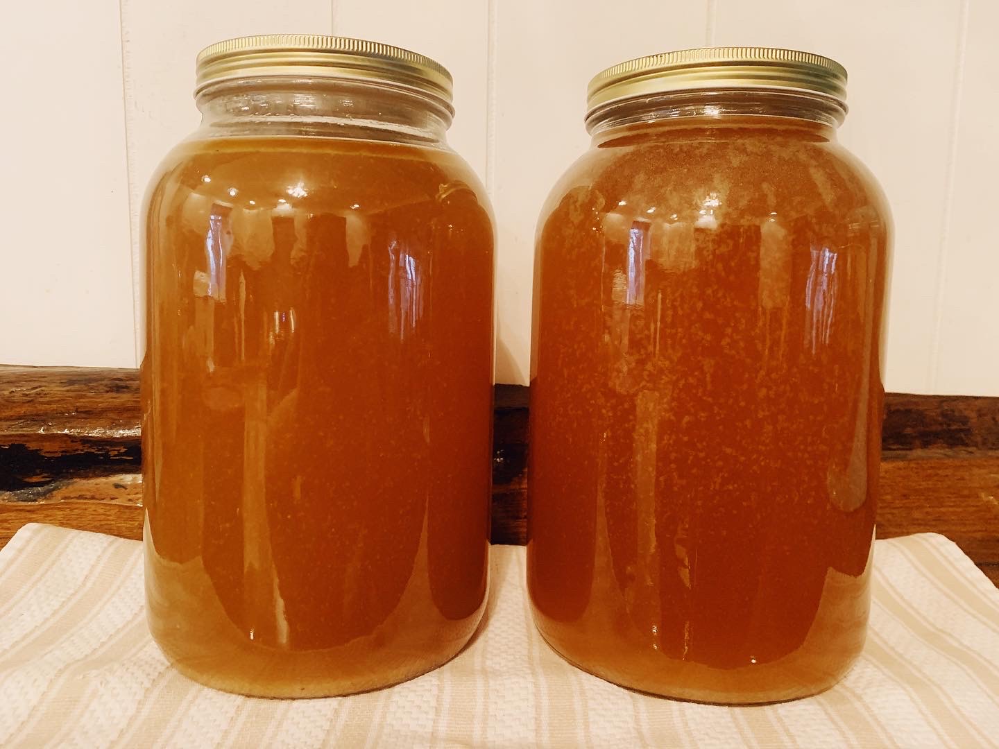 Two gallon jars of broth