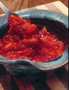 mashed strawberries in a bowl with fork