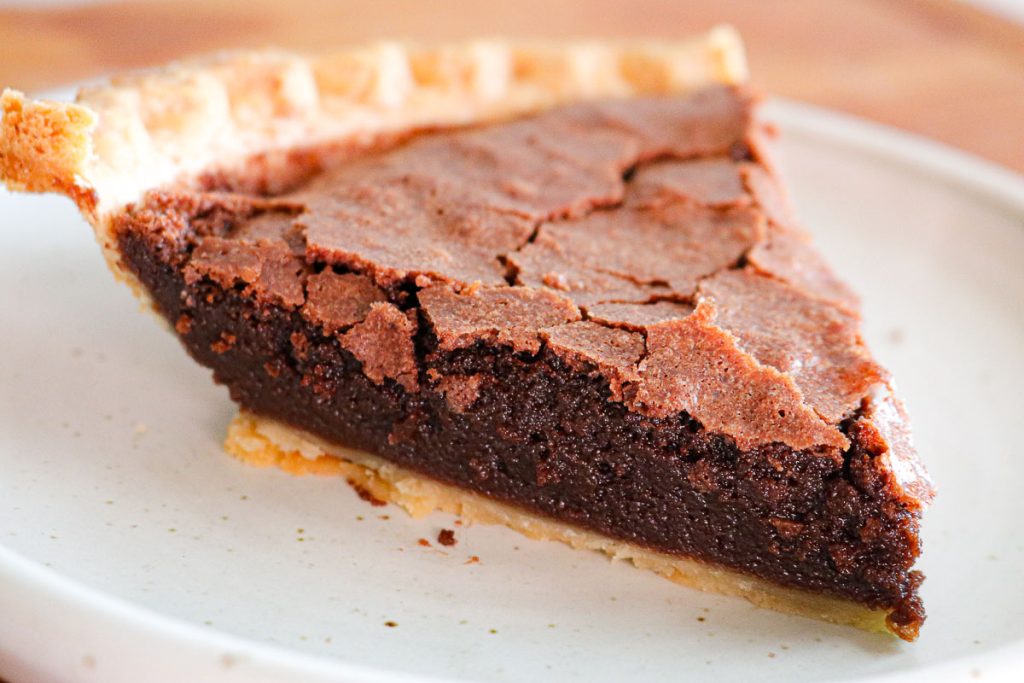 slice of chocolate fudge pie on a white plate