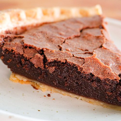 slice of chocolate fudge pie on a white plate