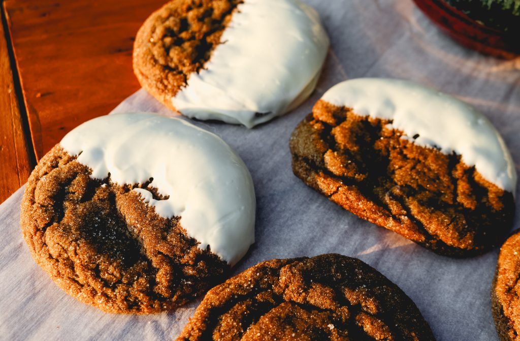 partially dipped ginger cookies with white chocolate