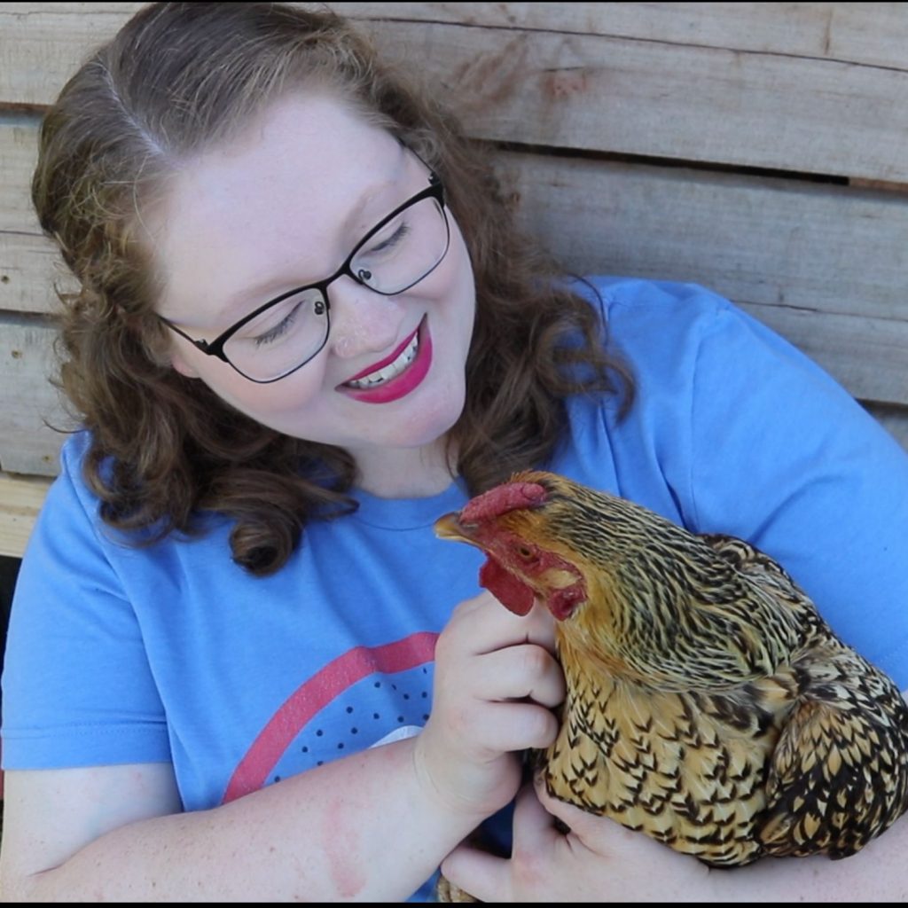 woman holding chicken