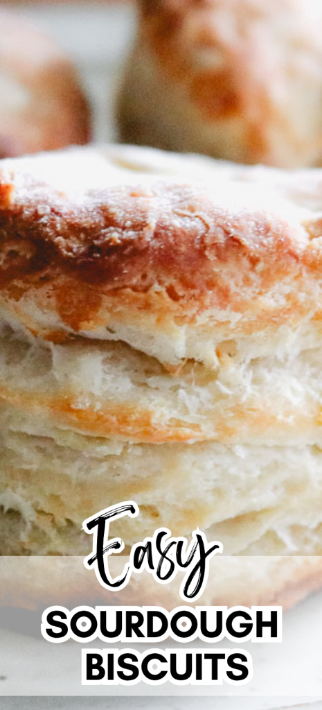 Close-up of flaky sourdough discard biscuits showing buttery layers and a golden crust.