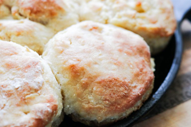 side shot of biscuits in a cast iron pan