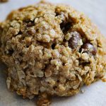 oatmeal chocolate chip cookie on parchment paper