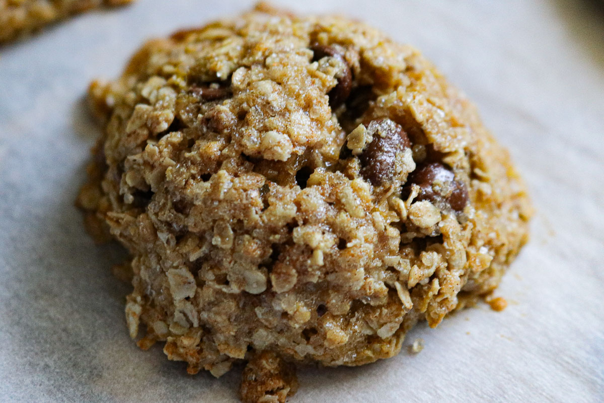 oatmeal chocolate chip cookie on parchment paper