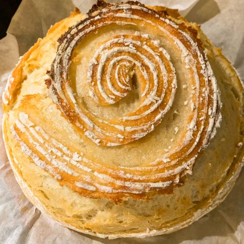 sourdough boule cut in a spiral pattern