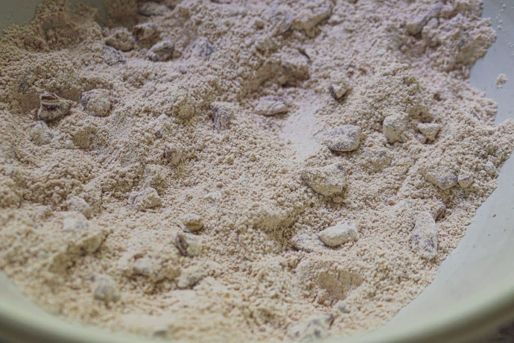 flour, nuts, cinnamon in white bowl