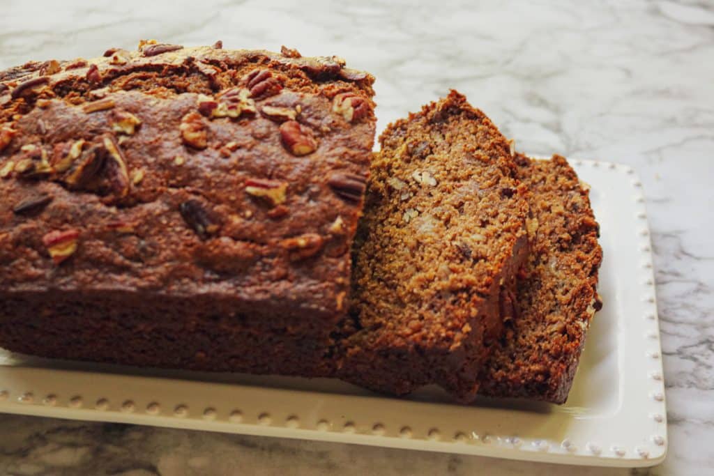 sliced banana bread on a white platter