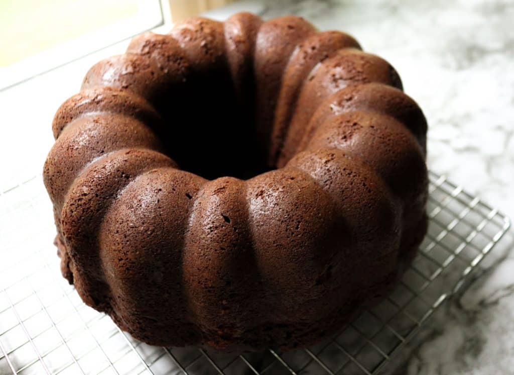 sourdough chocolate pound cake no icing on a wire cooling rack