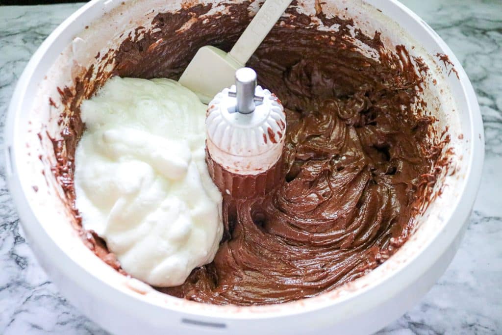 whipped egg whites in a chocolate cake batter