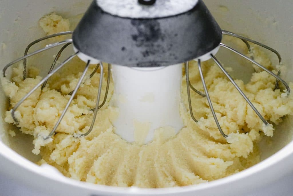 creamed butter and sugar in a white mixing bowl
