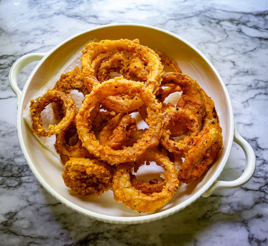 sourdough onion rings on a white plate