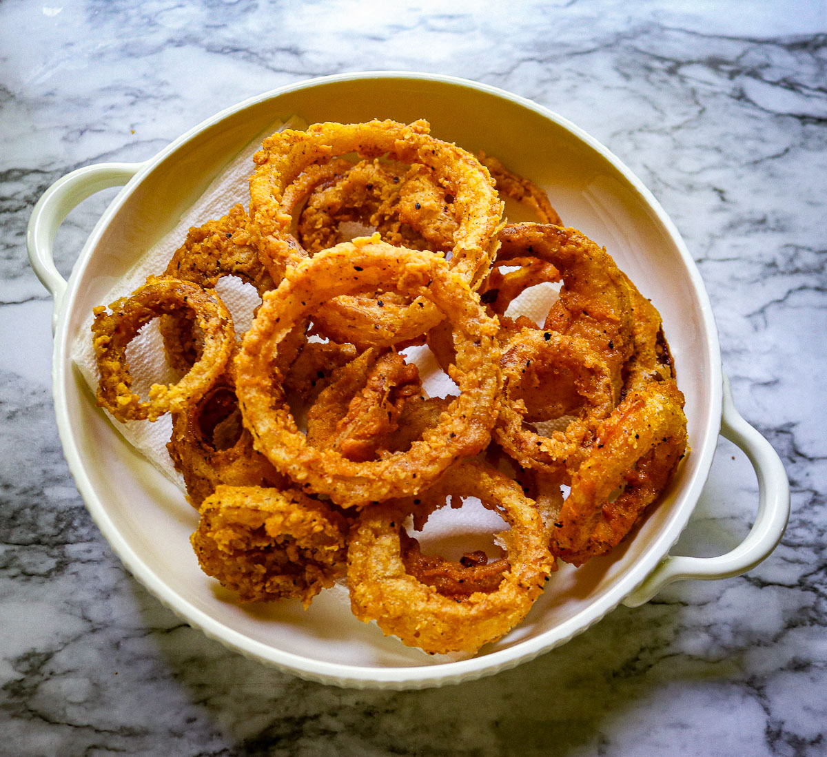 sourdough onion rings on a white plate