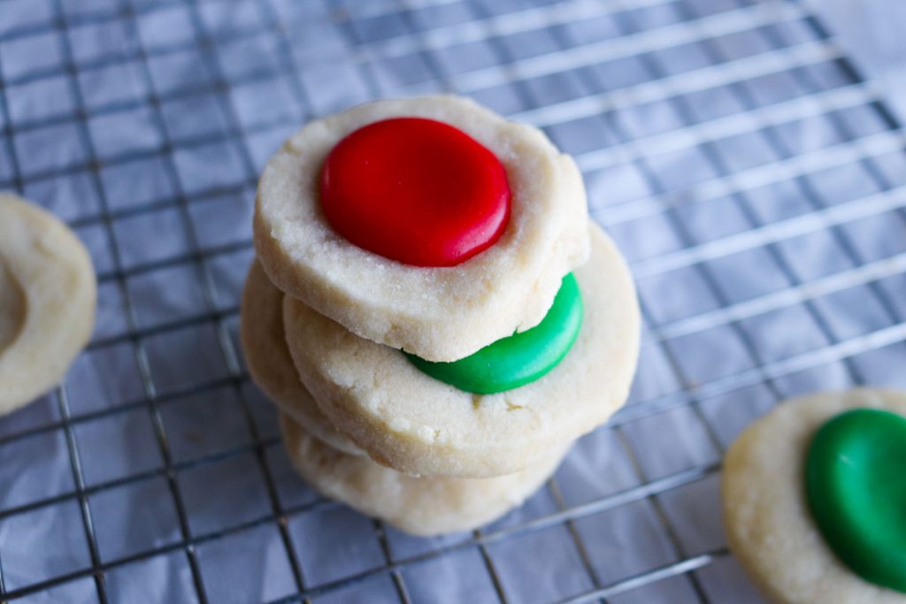 stack of red and green thumbprint cookies