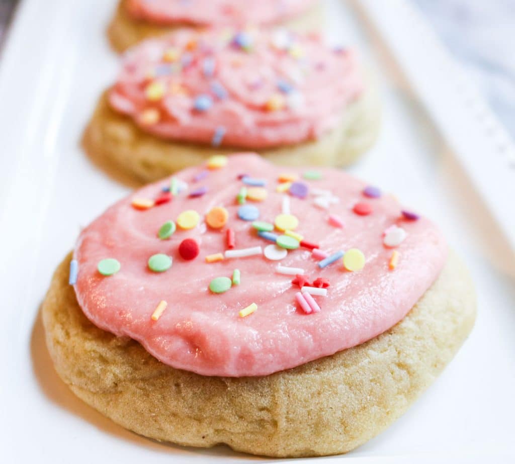 pink iced sugar cookies with sprinkles