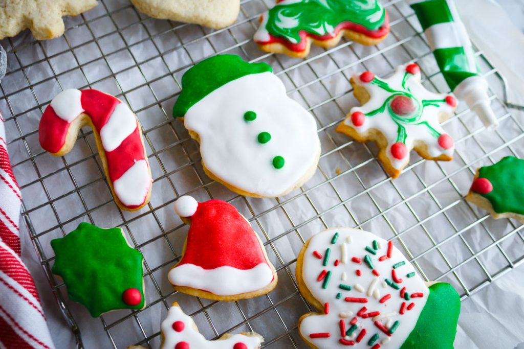 decorated christmas sugar cookies on a wire rack