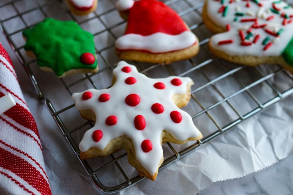 decorated christmas sugar cookies on a wire rack