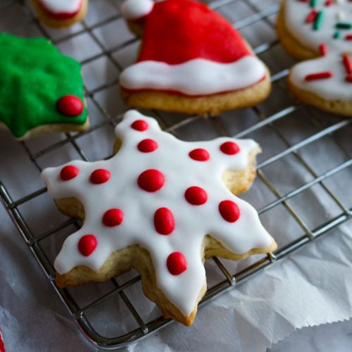 decorated christmas sugar cookies on a wire rack