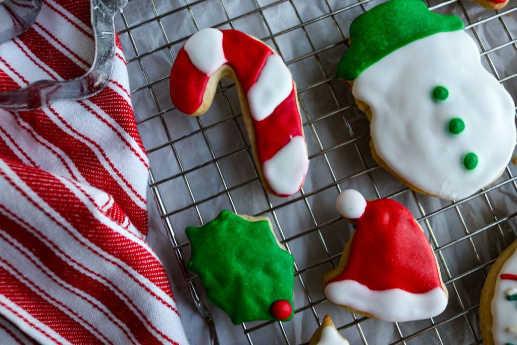 decorated christmas sugar cookies on a wire rack