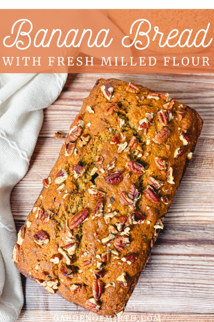 pinterest pin for banana bread with fresh milled flour featuring an image of banana bread with pecans on top