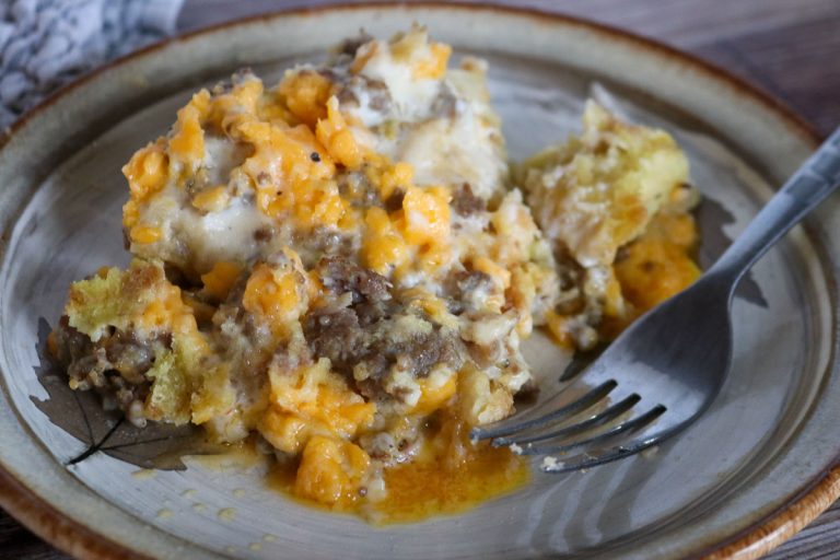 Plated sourdough breakfast casserole with sausage gravy and cheese