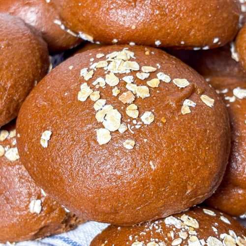 brown bread rolls with oats in a pile
