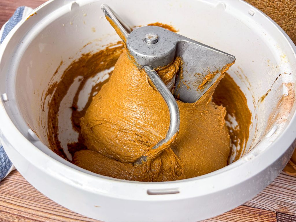 Bosch mixer full of brown bread dough that has been kneaded